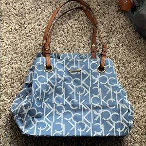 a stylish blue jean like Calvin Klein purse